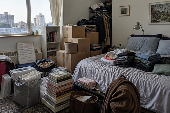Cluttered bedroom in Toronto being prepared for bed bug heat treatment